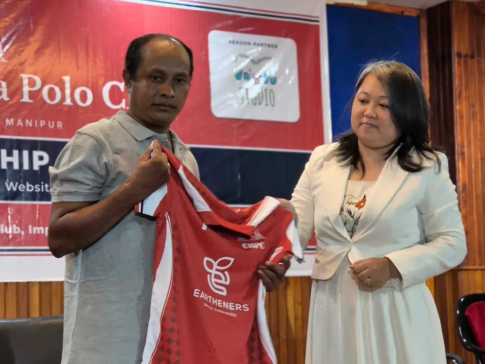 Tedawnshim Khaling of Unibrow Studio hands over a new jersey for the 2026–27 season