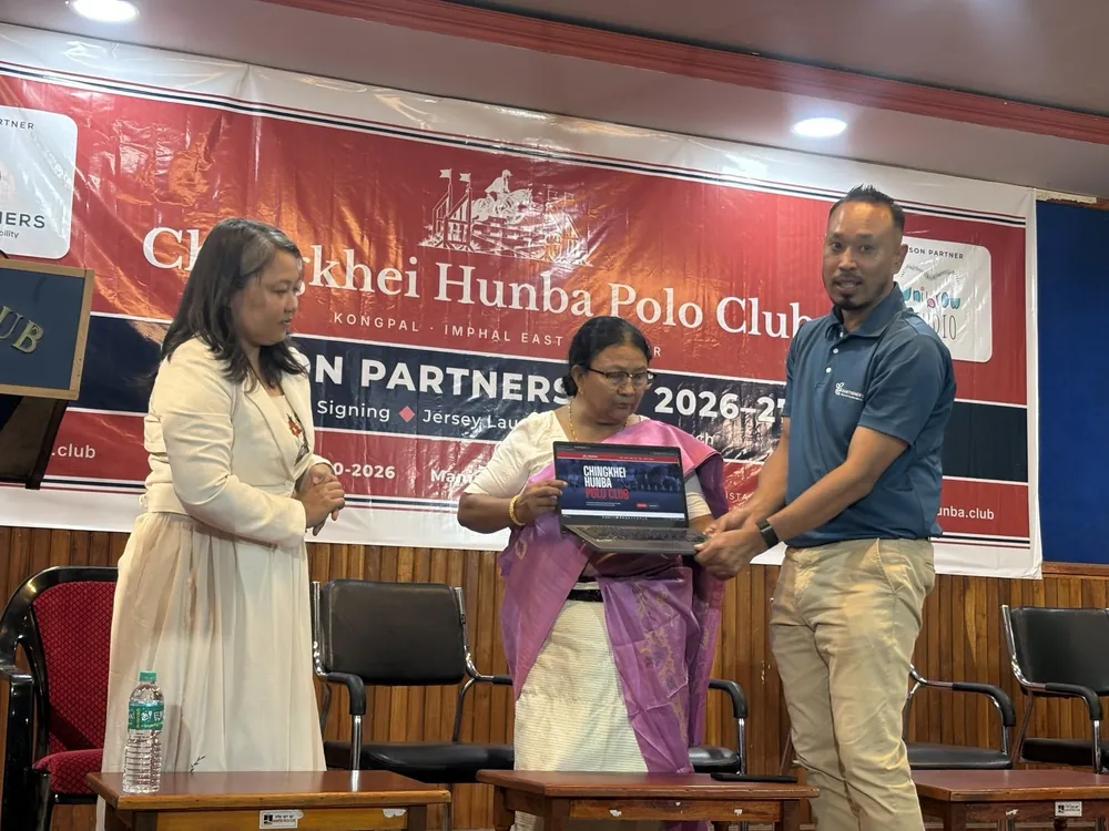 The club's President launches its website, chingkheihunba.club, on a laptop with Tedawnshim Khaling and Soraisam Devakishor Singh
